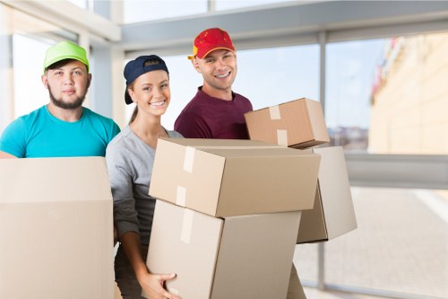 Local removals team handling a move in Highbury street setting